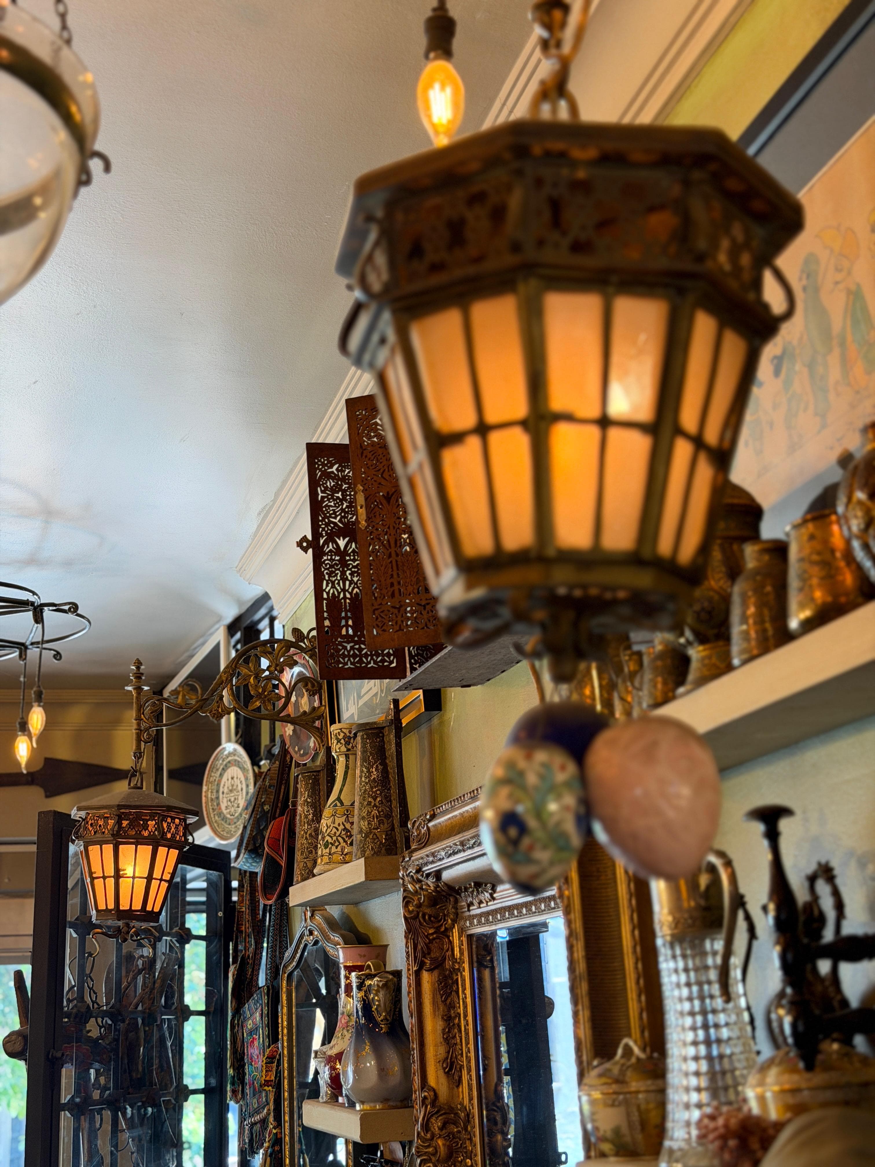 A glowing antique lantern overhead